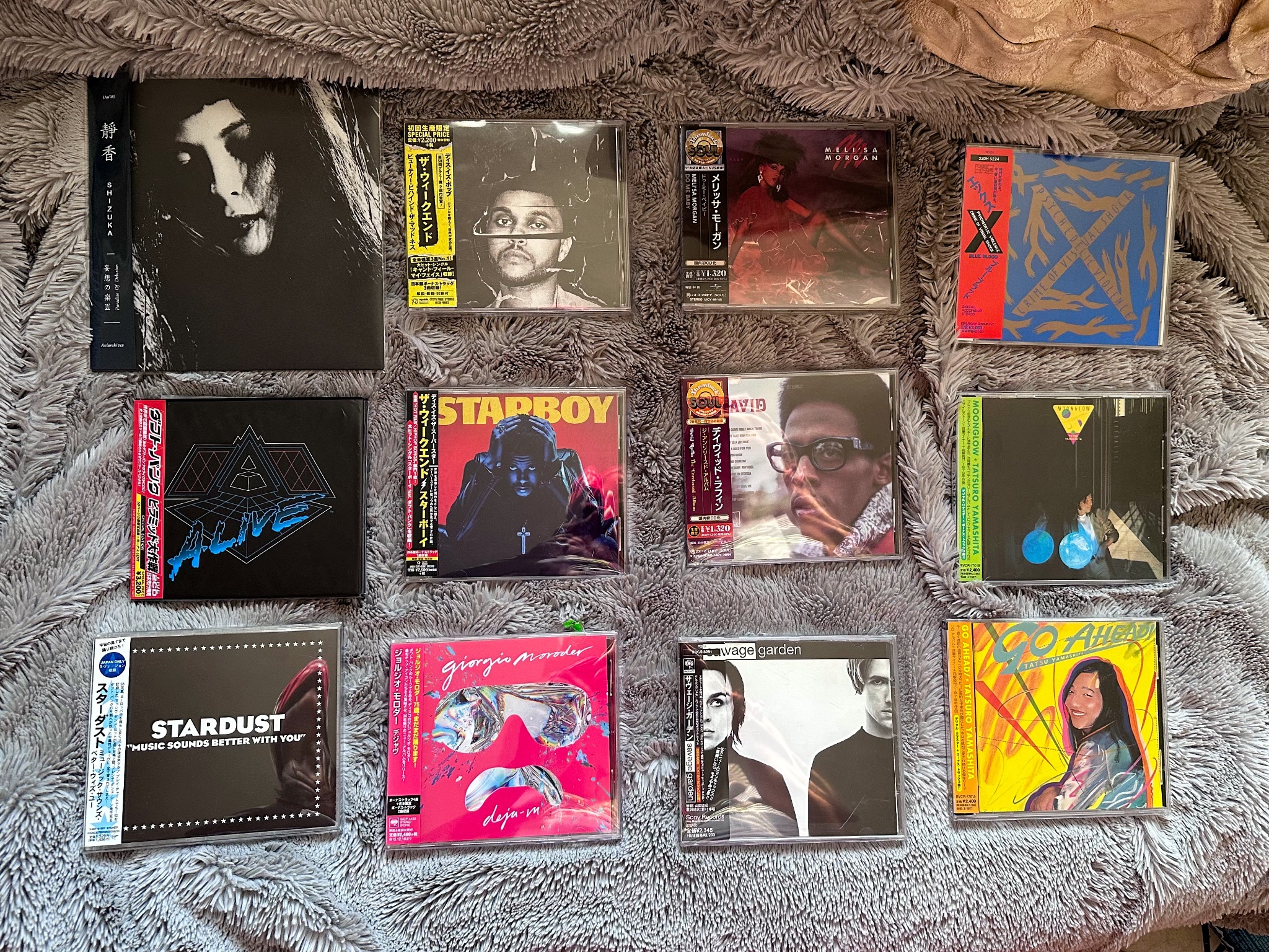  a bunch of CDs with the obis, Shizuka - Paradise of Delusion, Daft Punk - Alive 2007 (deluxe), Stardust - Music Sounds Better With You (maxi), The Weeknd - Beauty Behind the Madness, The Weeknd - Starboy, Giorgio Moroder - Deja Vu, Meli’sa Morgan - Do Me Baby, David Ruffin - The Unreleased Album, Savage Garden - Savage Garden, X Japan - Blue Blood, Tatsuro Yamashita - Moonglow, Tatsuro Yamashita - Go Ahead! 