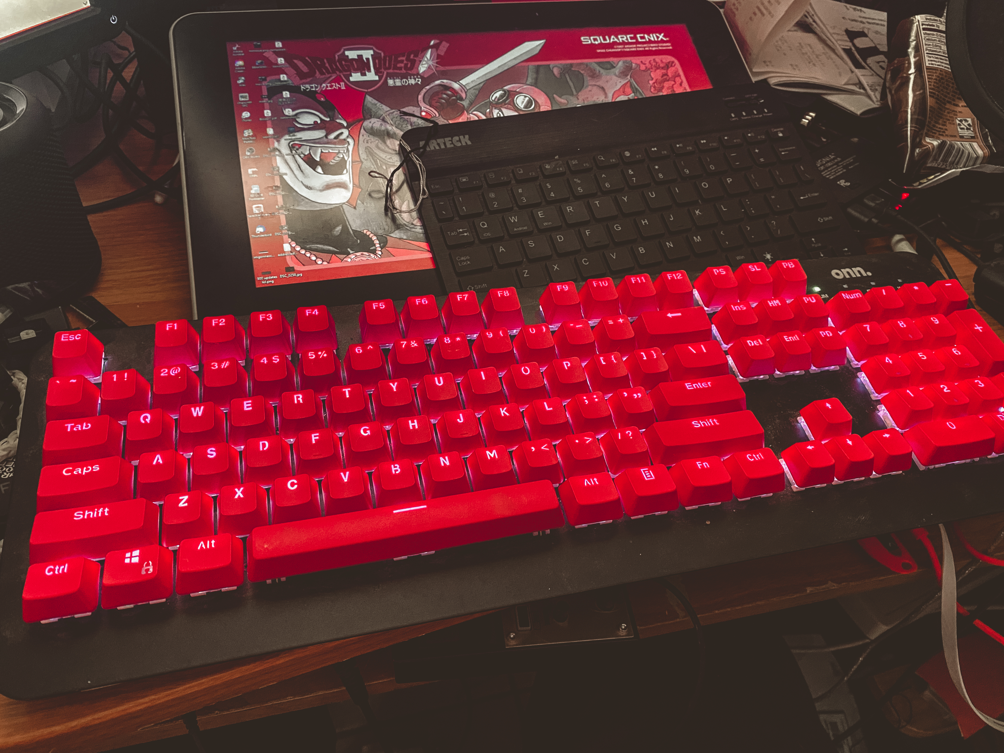 a picture of a keyboard with red backlit keycaps and white LEDs